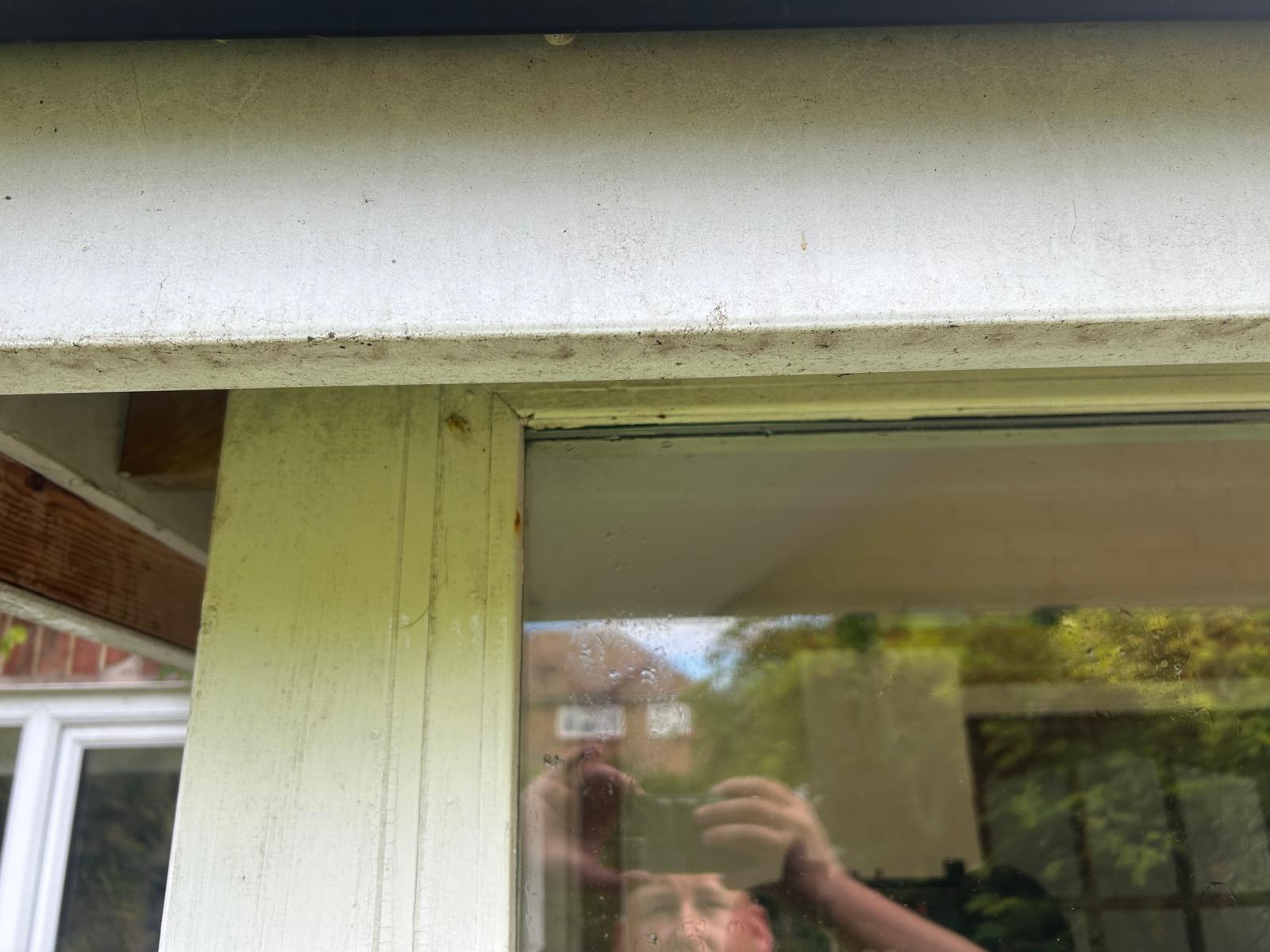 Window frame before exterior cleaning